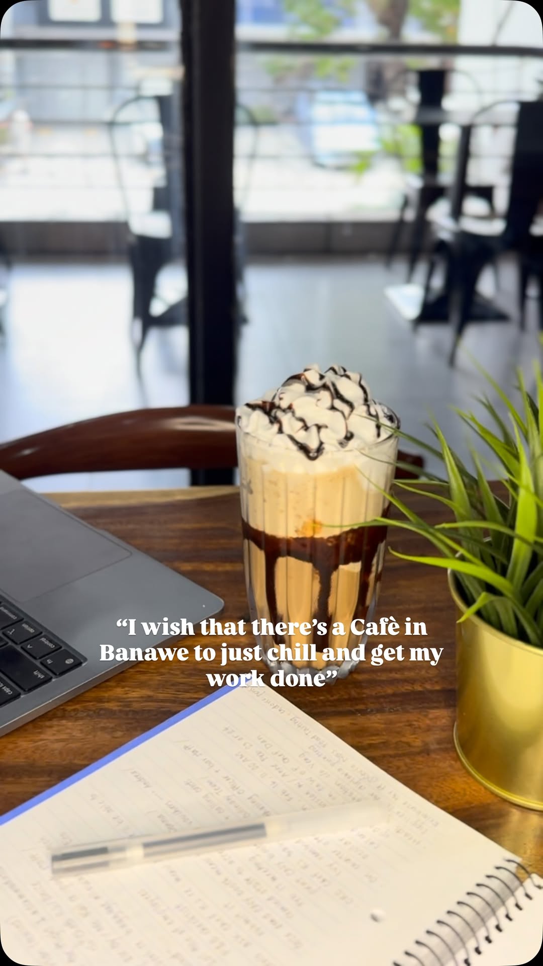 The Coze Café — iced mocha at a window table, work-friendly ambiance